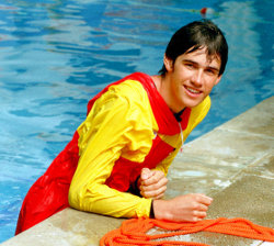 lifeguard in pool with rope and anorak