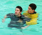 RESCUE, CASUALTY, CONSCIOUS, 2 APPROACH
Approach the casualty from behind and pick up with an approriate tow 2